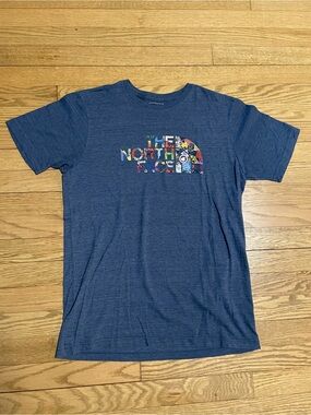 The North Face International Collection Blue Collage Logo Graphic T-shirt - Sz M
